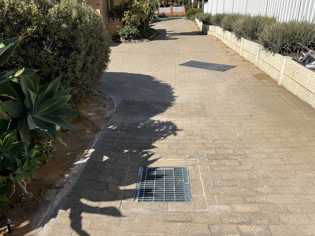 Completed paving and driveway drainage result